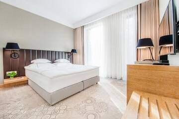 Фото номера Двухместный номер с 1 кроватью, вид на сад Отель Tiffi Boutique Hotel г. Ольштын 5